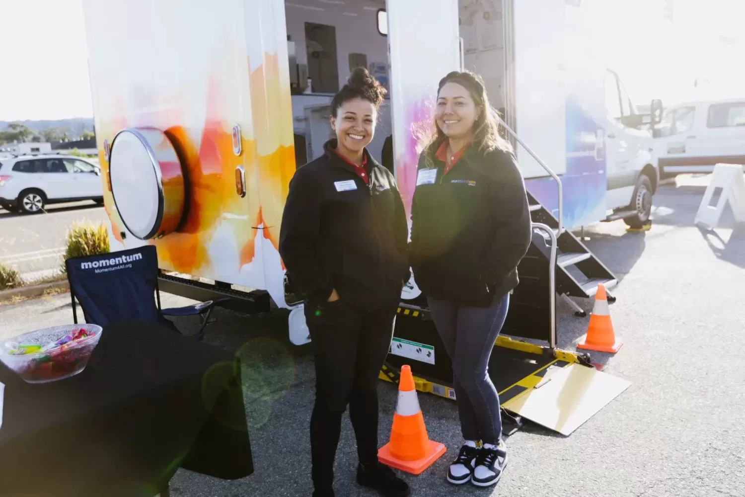 Two Girls Outside Momentum Refresh Vehicle